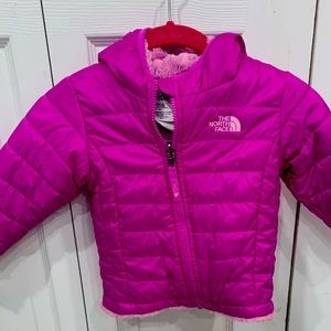 Purple, fleece-lined North Face jacket.